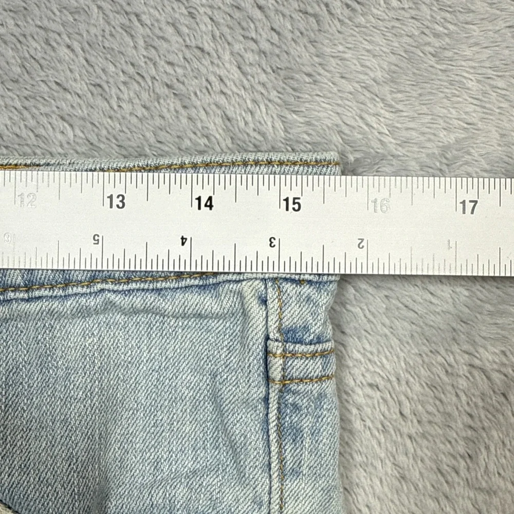 Vintage Levi's 518 Superlow Bootcut Jeans 31x31 Blue Light Wash Low Rise Stained